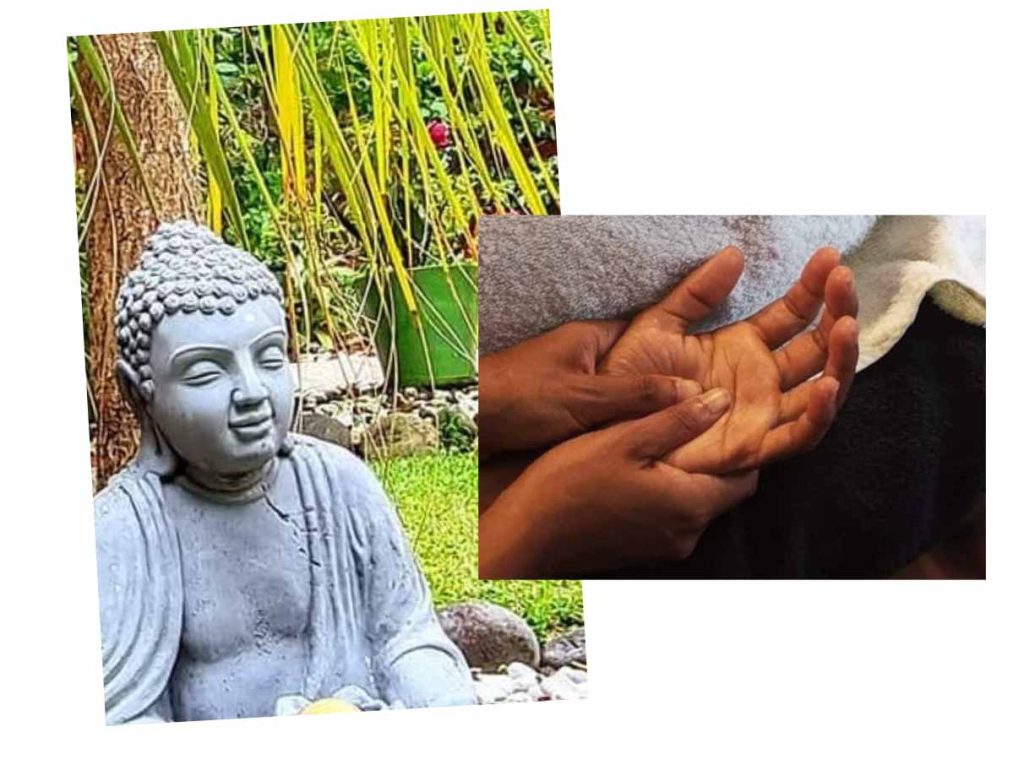 Bouddha en pierre dans un jardin et massage des mains