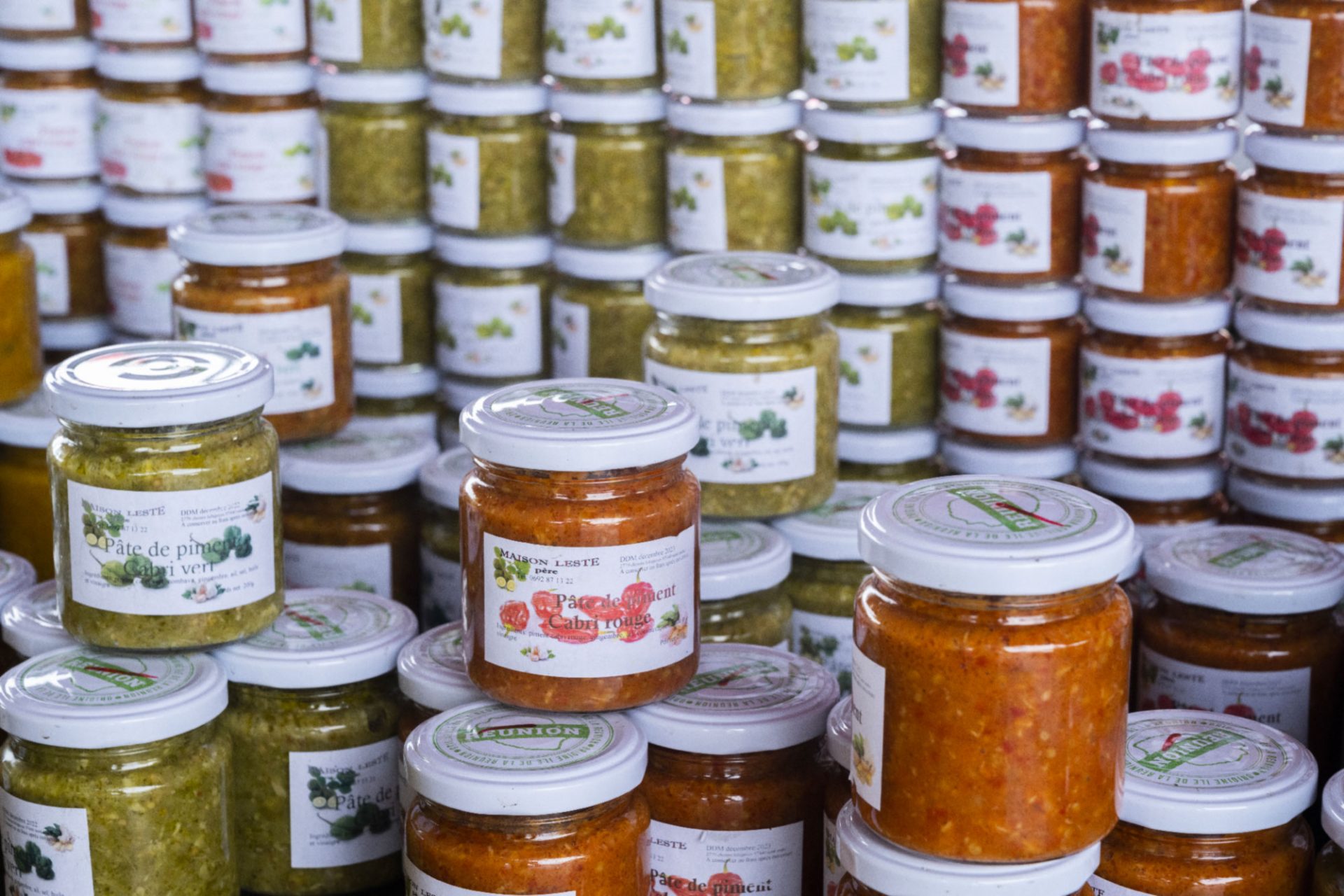 Jars of peppers on a fairground market in the east of Reunion