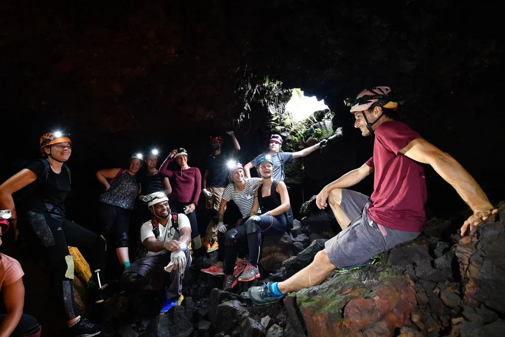 group of people in a lava tunnel