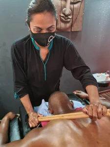 Bamboo massage on a man's back