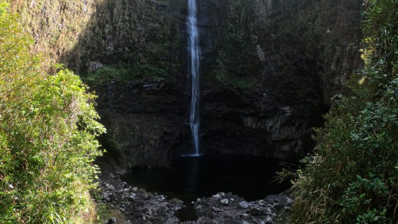 View of a waterfall from the hiking trail in the Takamaka Valley in Saint-Benoît